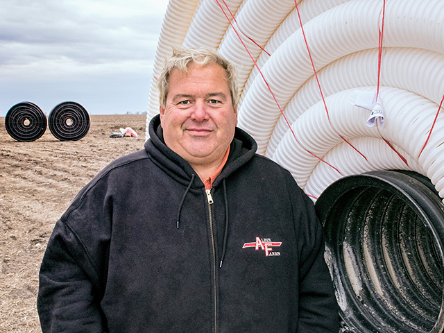 Installing tile at his own expense is a win-win for Dave Albin and the landowners, Image by Dave Charrlin