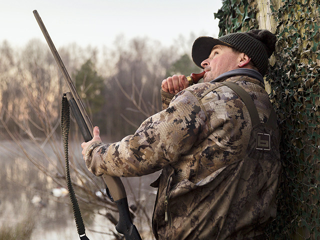 Seth Thompson calls ring-neck ducks into a decoy-populated impoundment in eastern North Carolina. (DTN/Progressive Farmer photo by Thomas Harvey)