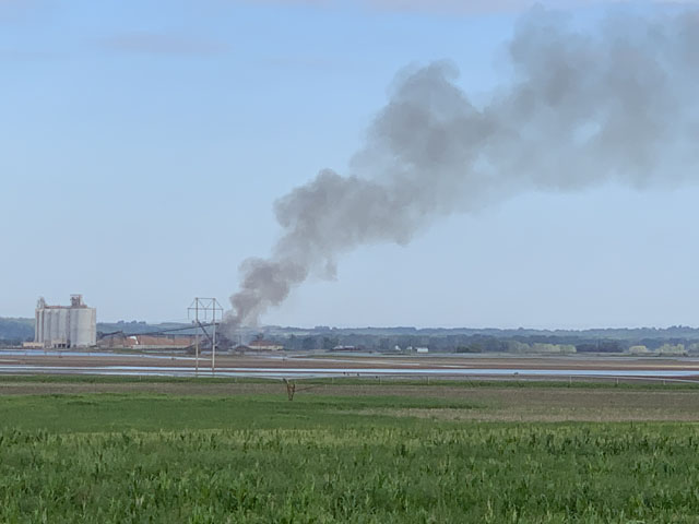 Smoke rolls from an outdoor pile of soybeans that combusted during the summer heat earlier this month off Interstate 29 in northwest Missouri. (Photo courtesy of Richard Oswald) 