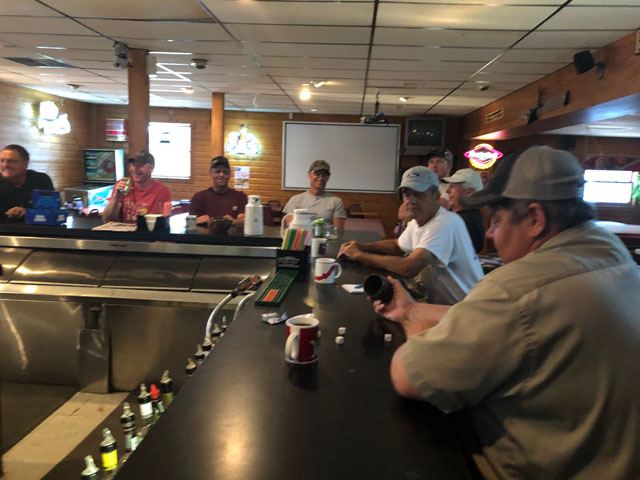Kevin Paap, president of the Minnesota Farm Bureau, rolls dice to see who pays for coffee at a Friday morning breakfast in Vernon Center, Minnesota. Farmers were pleased at the average $74 payment rate under the Market Facilitation Program for their county. (DTN photo by Chris Clayton) 