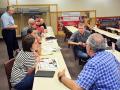 At a University of Nebraska-Lincoln Extension meeting about farm stress, attendees break into small-group discussion about how stress affects them individually. (Progressive Farmer image by Russ Quinn)
