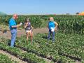 University of Guelph student Isabelle Aicklen tries to answer farmer questions about weed control from Jenny Schweigert (right) during a national weed science contest. Her answers are being judged by Gary Schwarzlose, Bayer. (Progressive Farmer image by Pamela Smith)