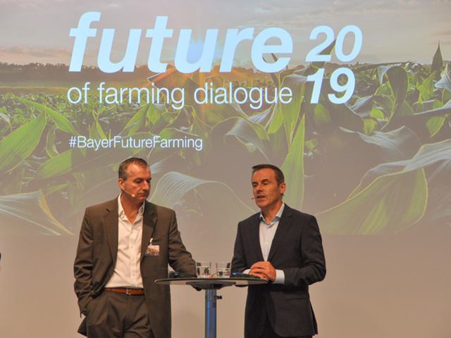 Bob Reiter (left) and Liam Condon (right) talk about Bayer&#039;s new products and research at the company&#039;s annual Future of Farming Dialogue hosted in Germany this week. (DTN photo by Emily Unglesbee)