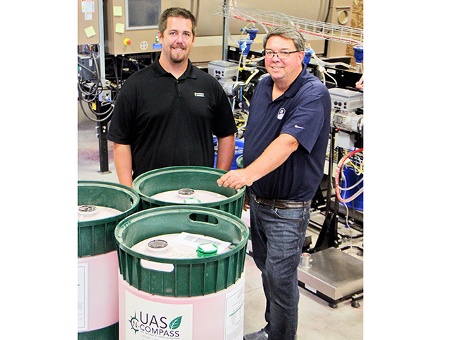 Seed treatment is especially important when planting soybeans early, Brad and Jacob Wade believe. They are constantly studying and evaluating new products. (Progressive Farmer image by Pamela Smith)