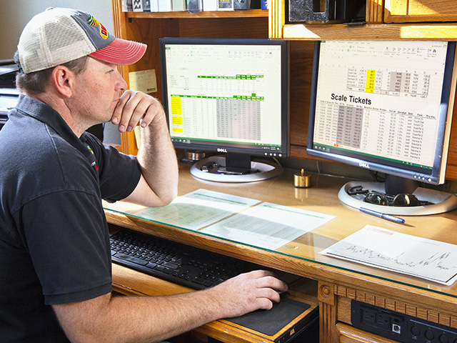 Shane Sand tracks costs, such as land, loans, repairs, grain storage, freight and drying, with a master Excel sheet. (Progressive Farmer image by John Borge)