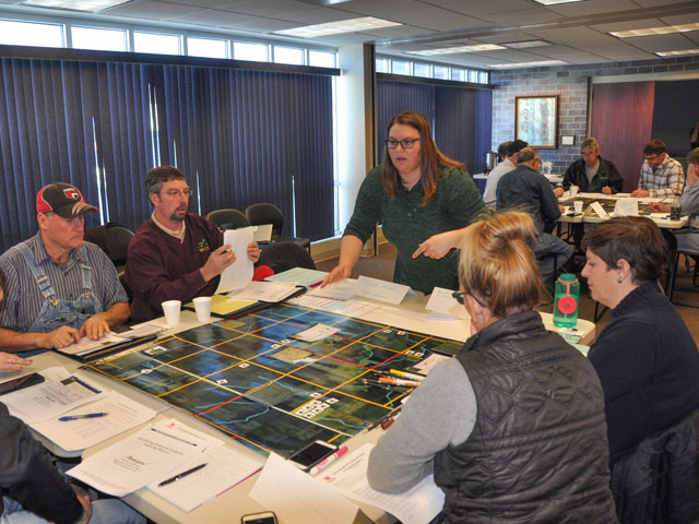 Attendees of the University of Nebraska-Lincoln (UNL) Extension&#039;s Optimizing Poultry Manure Value in Cropping Systems meeting broke into smaller groups at the Feb. 26 gathering in David City, Nebraska. The two groups had to identify preferred fields for applying manure. (DTN Photo by Russ Quinn)