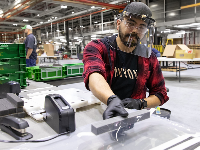 Jerry Miller, an assembler at John Deere Seeding Group in Moline, Illinois, assembles protective face shields for health care workers. (Image courtesy of John Deere)