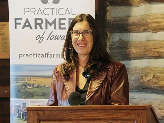 Ruth Rabinowitz accepts the 2025 Farmland Legacy Award in a Practical Farmers of Iowa celebration on Oct. 23 in Winterset, Iowa. (Photo courtesy of Practical Farmers of Iowa)