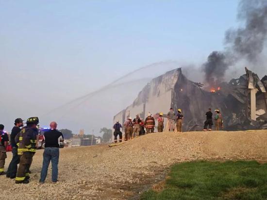 Emergency crews respond to the fire July 28, 2026, at the Agri Star Meat &amp; Poultry processing plant in Postville, Iowa. (Photo By: Dina Hackley Taylor)