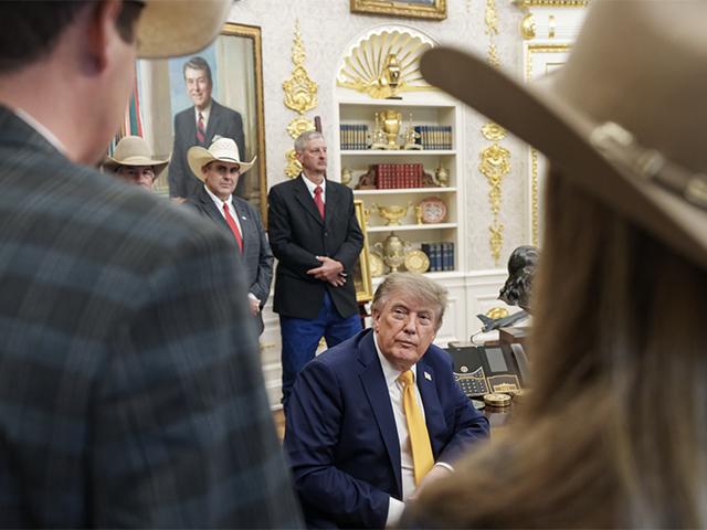 President Trump looks aside to ranchers who stood behind him in Friday's Oval Office beef announcement. R-CALF USA President Dave Hyde from Ohio and Shad Sullivan, a rancher from Texas, stand in the background. (Photo courtesy of USDA, Brooke Rollins)
