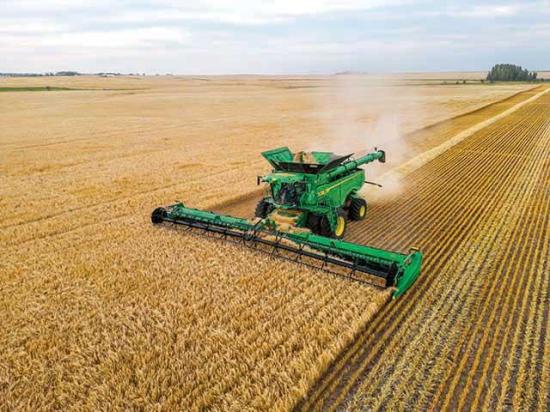 Deere&#039;s new S7 combines remove operator burden by automatically adjusting crop flow through the combine. Two stereo cameras give the combine and operator the ability to judge crop mass and height. (Photo courtesy of John Deere)