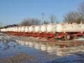 Anhydrous ammonia tanks wait for farmers to apply nitrogen fertilizer. U.S. fertilizer imports in 2025 declined dramatically as the year progressed, according to The Fertilizer Institute (TFI). (DTN file photo by Russ Quinn)