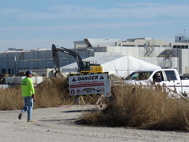 The Sustainable Beef worksite is currently limited to construction workers and danger signs are posted along the road on the plant&#039;s north side. But the plant will soon be operational and will quickly become one of the city&#039;s biggest employers, bringing an estimated 2,500 people to North Platte, as employees and their families move in to fill the predicted 800 jobs. (Photo by Lori Potter for the Flatwater Free Press)