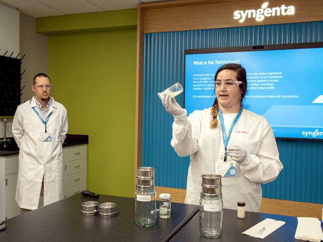 Beth Williard, senior formulation development chemist for insecticides, demonstrates the fertilizer compatibility of Plinazolin insecticide technology compared to an unnamed competitor during the biennial Syngenta Crop Protection Media Summit held at the company&#039;s North American Crop Protection headquarters in Greensboro, North Carolina, Oct. 1-3. (DTN photo by Jason Jenkins)