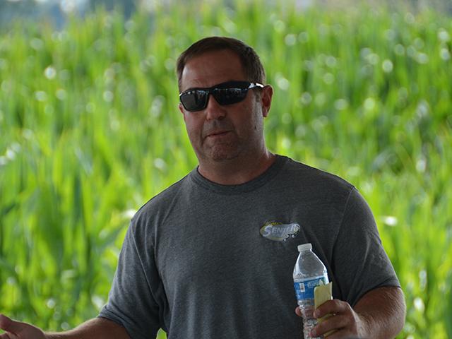 Travis Senter II speaking about technology at a conservation farm tour last month in Arkansas. Senter has gotten better at querying ChatGPT to quickly get questions answered on his farm or summarize materials people send to him. (DTN photo by Chris Clayton)