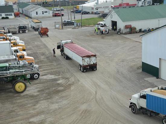 During wheat harvest, trucks and equipment line the farm headquarters. But since a March 16 Federal Motor Carrier Safety Administration rule, some workers have been unable to obtain commercial driver's licenses after the agency halted the issuance of non-domiciled CDLs in some states. (File photo by Chris Clayton)