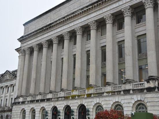 USDA's headquarters building in Washington, D.C., earlier this month. USDA will need to create rules to divvy up disaster aid and economic aid from the farm bill extension. Several USDA programs, however, also are now unauthorized to operate unless renewed in the next farm bill. (DTN photo by Chris Clayton)