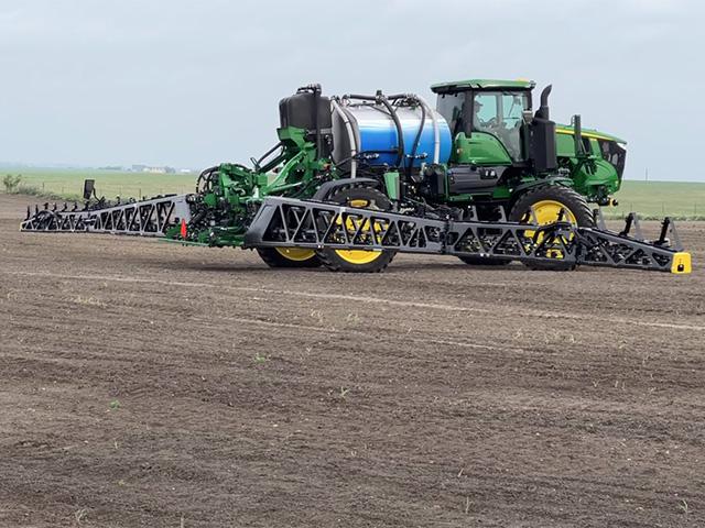 John Deere has announced new layoffs but also points out it has invested $2.5 billion in a new 9RX tractor line, X9 combine assembly and See and Spray. (DTN photo by Dan Miller)