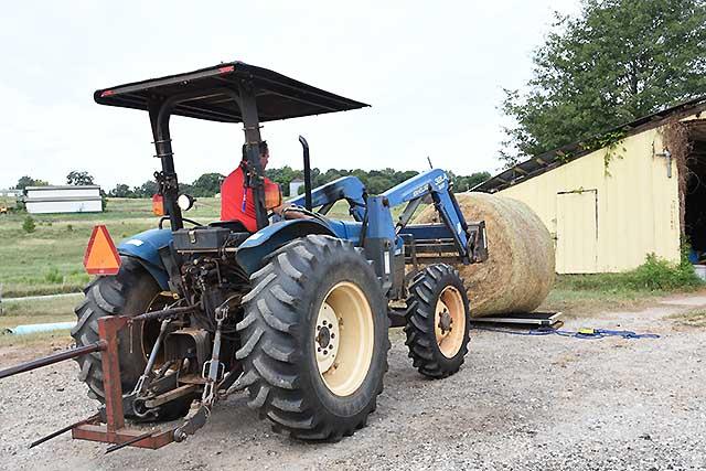 Greg Pittman occasionally weighs a bale of his homegrown hay, so he&#039;ll know how much hay he&#039;s actually feeding his cows. (DTN/Progressive Farmer photo by Becky Mills)