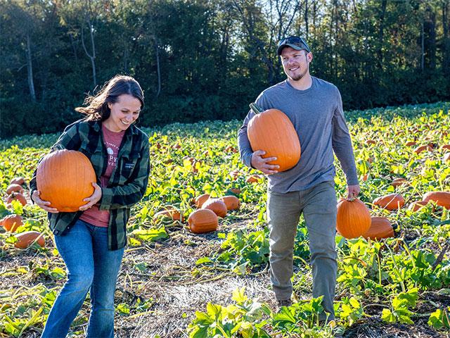 It was the pull of pumpkins that drew Dana (left) and Lucas Dull back to Dull's Tree Farm. Nearly 80,000 visitors, including thousands of local schoolchildren, flock each fall to this agritourism gem in Indiana. (DTN/Progressive Farmer photo by Joel Reichenberger)