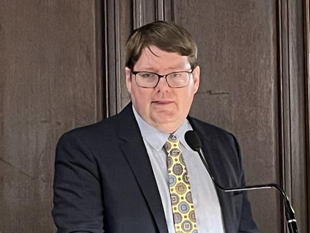 Deputy Agriculture Secretary Stephen Vaden speaking Monday to agricultural journalists. Vaden continued to press the case that the fertilizer industry is too consolidated and suggested companies work to keep competition out of the market. (DTN photo by Chris Clayton) 