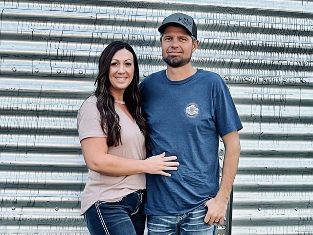 With a yield of 170.14 bpa, Dallin Wilcox of Rexburg, Idaho, pictured here with his wife, Kasandra, earned the title of Bin Buster in the irrigated spring wheat category of the 2023 National Wheat Yield Contest. (Photo courtesy of Dallin Wilcox)