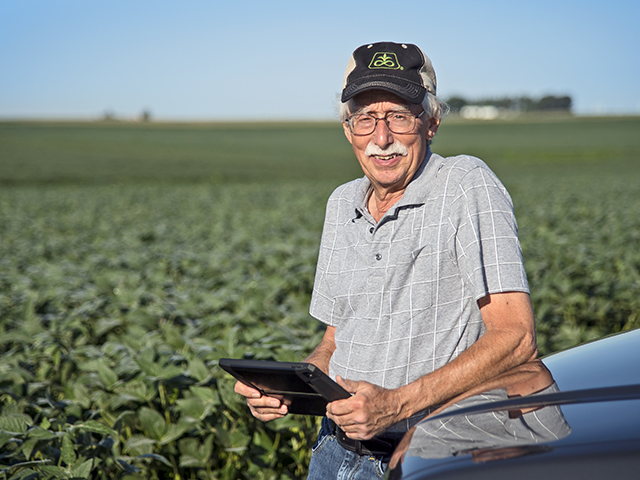 Bill Butler studies a pool of data to make decisions that help cut costs and increase his profits. (Progressive Farmer image by Greg Baker)