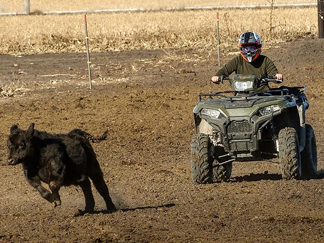 Iowa couple AJ and Kellie Blair find many uses for an ATV on their diversified farm. (DTN/Progressive Farmer photo by Jim Patrico)