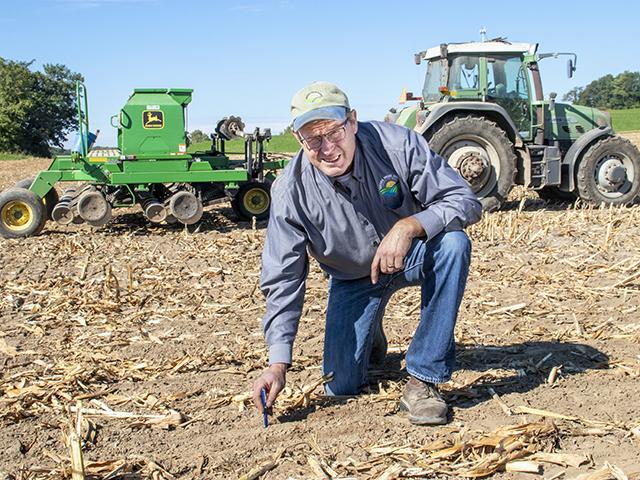 Jeff Endres drills winter rye and spring barley into chopped corn silage stubble. Cover crops have proven to be an effective practice to reduce P losses from fields. (Harlen Persinger)