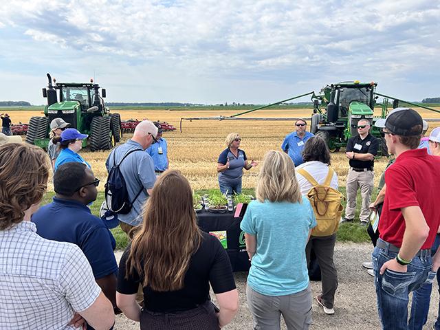 Participants in the Conservation Technology Information Center tour in central Michigan listen to a pitch about cover crop seed mixes from Indiana-based CISCO Seeds at Zwerk Farms near Vassar, Michigan. (DTN photo by Chris Clayton)