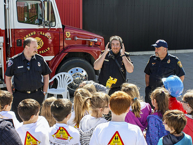 At a Safety Day event, students learned important fire safety tips from emergency service professionals. (Progressive Agriculture Foundation)