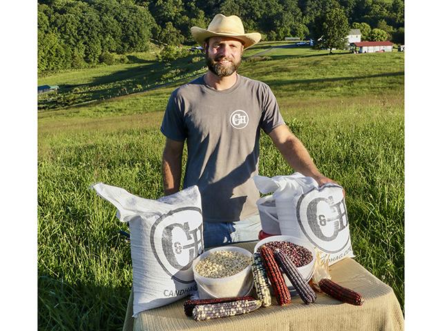 Drew Carter grows heirloom corn varieties for distilleries against the backdrop of his family&#039;s hilly southwest Virginia farm. (Des Keller)