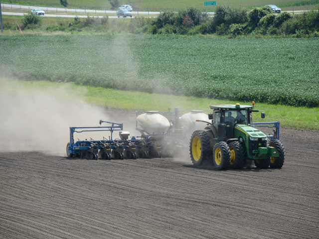 Ethan Parker, a Kinze Manufacturing test engineer, plants soybeans on Aug. 19 in a demonstration field to show off the company&#039;s latest technological improvements and features for 2022 planters. (DTN photo Matthew Wilde)