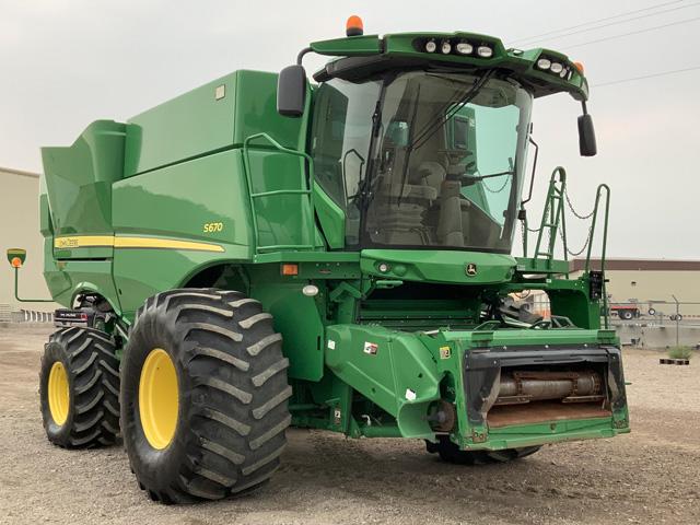 Grain trailers, low-hour tractors and low-hour combines are super-hot sellers. This 2016 John Deere S670 from American Falls, Idaho went for a premium. (Photo courtesy of BigIron Auction)