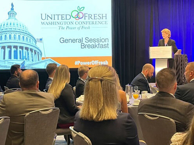 Senate Agriculture Committee Chairwoman Debbie Stabenow, D-Mich., urges the fruit and vegetable growers to "please be loud" when discussing the importance of immigration reform. (Photo by Jerry Hagstrom)