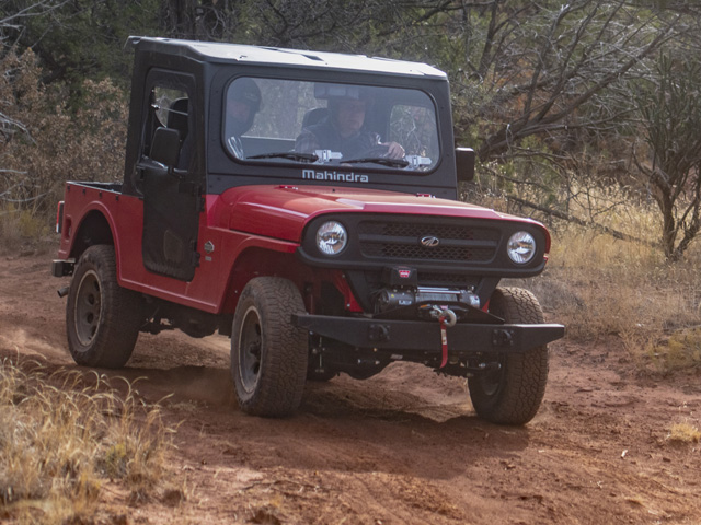 A trio of Mahindra Roxor side-by-side vehicles make their way down a rocky trail near Ribera, New Mexico. (DTN photo by Joel Reichenberger)