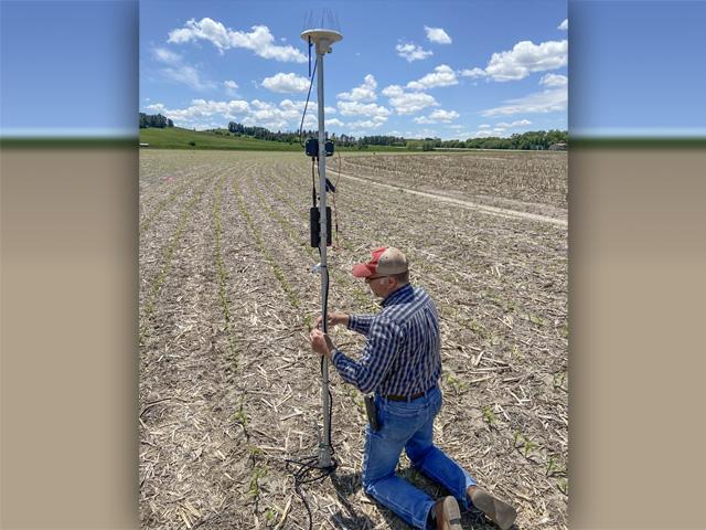 Portable field sensors measure atmospheric aridity as part of a new irrigation scheduling algorithm under evaluation by the University of Nebraska-Lincoln. The Supply-Demand Dynamic algorithm combines soil moisture levels, evapotranspiration estimates and plant-physiology models to improve irrigation application decision making. (Photo courtesy of University of Nebraska-Lincoln)