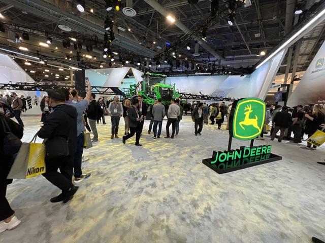 John Deere featured a large display at CES showcasing its newest technologies, such as See and Spray, ExactShot and a battery electric excavator. (DTN/Progressive Farmer photo by Dan Miller)