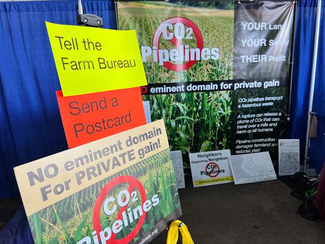 A group opposed to carbon pipelines had a booth last week at the Farm Progress Show. On Wednesday one of the major pipeline proposals in the Midwest from the company Navigator CO2 had their permit denied by the South Dakota Public Utilities Commission. (DTN photo by Chris Clayton) 
