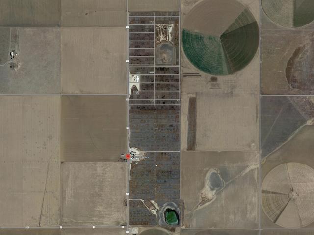 A satellite image of 7M Feeders, a 115,000-head-capacity feed yard near Friona, Texas, one of two Texas feed yards tied to McClain Farms in Benton, Kentucky. USDA has at least 96 claims from cattle producers or livestock businesses for more than $122 million in losses involving the McClain feeders. (Satellite image from Google)