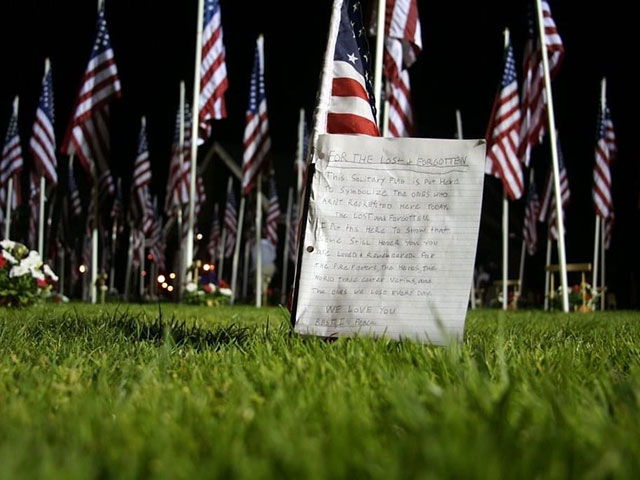 In 2006, the fifth anniversary of 9/11, there was a display in Salem, Oregon, of nearly 3,000 flags representing the nearly 3,000 people who died on 9/11. People left flowers and letters to thank and remember those who died. A child left this letter in tribute to the victims. (DTN photo by Elaine Shein)