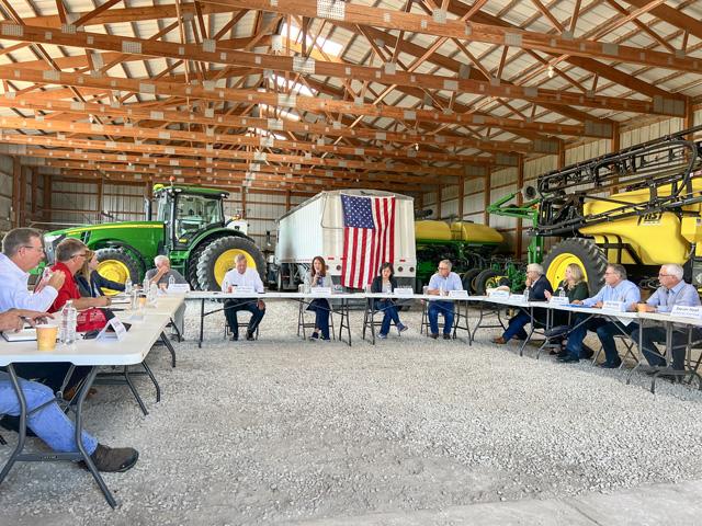 At the center of the table, U.S. Agriculture Secretary Tom Vilsack, Rep. Cindy Axne, D-Iowa, and U.S. Trade Ambassador Katherine Tai listen to a roundtable of more than a dozen farmers and livestock producers talk mainly about trade concerns, especially fertilizer tariffs and Mexico&#039;s toughening stance on biotechnology approvals. (DTN photo by Chris Clayton) 