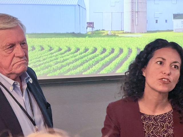 Former Rep. Collin Peterson of Minnesota and USDA Undersecretary for Rural Development Xochitl Torres Small talk with agricultural producers and agribusiness people after a policy forum Monday in Detroit Lakes, Minnesota. (DTN photo by Chris Clayton)
