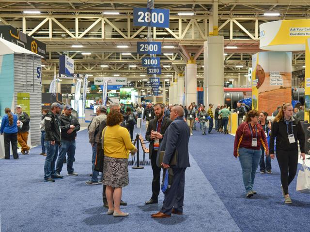 People check out the trade show at the 2021 Commodity Classic in New Orleans. Nearly 8,000 farmers, exhibitors and other agricultural officials attended the show from March 10-12. (DTN photo by Matthew Wilde)
