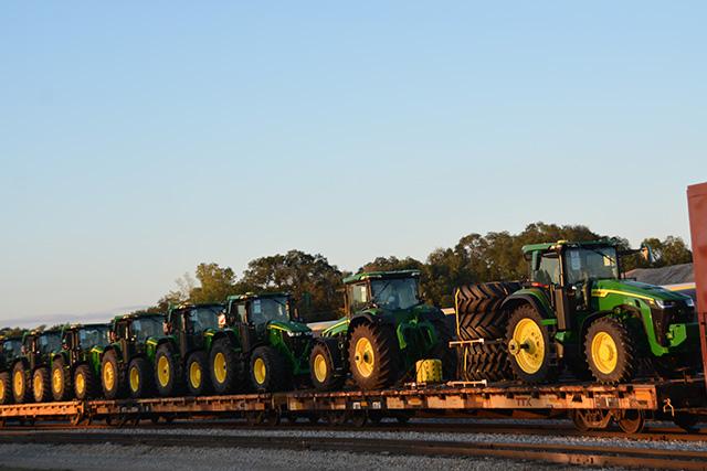 A line of tractors on rail cars outside the Deere &amp; Co. plant in Waterloo, Iowa, earlier this week. Production at Deere&#039;s 14 U.S. facilities could shut down with the United Auto Workers International announcing early Thursday that its 10,000-plus members will go on strike following failed negotiations with Deere on a new contract. (DTN photo by Chris Clayton) 