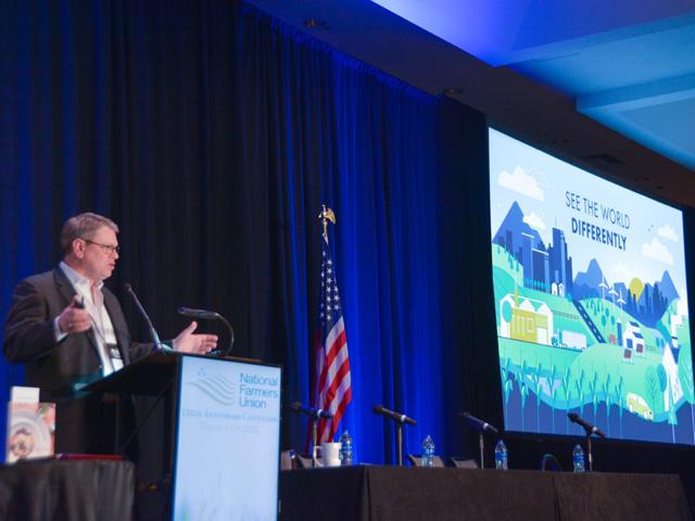 Doug Berven, vice president of corporate affairs for POET, talks to members of the National Farmers Union at the group&#039;s annual meeting in Denver this week about compensating farmers for their efforts to reduce emissions and the possible avenues to expand ethanol into industries such as aviation. Berven highlighted the pathways to getting biofuels to become carbon neutral. (DTN photo by Chris Clayton)