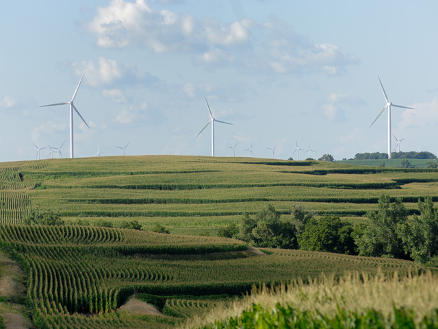 Wind turbines, a common sight already in rural America, would expand under a deal struck among Senate Democrats to address climate change. The legislation also would lead to more farmers applying practices to sequester carbon in the soil. (DTN/The Progressive Farmer file photo by Jim Patrico)