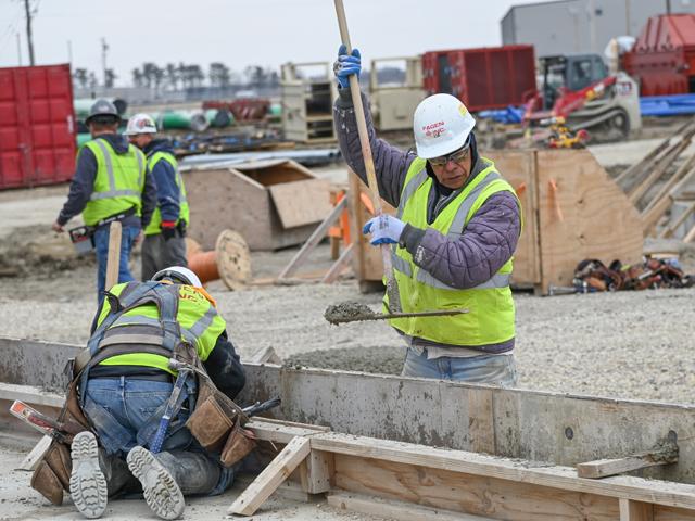 Fagen Inc. employees form and pour concrete footings at Shell Rock Soy Processing in Shell Rock, Iowa. The crush plant, one of more than a dozen soy processing projects in the works, is expected to be operational by the end of the year. (DTN photo by Matthew Wilde)