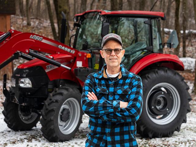 Steve Wilson of Rochester, Minnesota, and the Farmall utility 75C he won as part of Case IH's 100-year celebration of the Farmall line. (DTN image courtesy of Case IH)