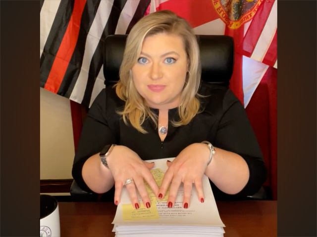 Rep. Kat Cammack, R-Fla., during a Facebook video last week, highlights the size of the Build Back Better Act, but the congresswoman makes false claims that the bill would tax livestock and drive up the prices of meat in the process. (DTN photo from Facebook video)
